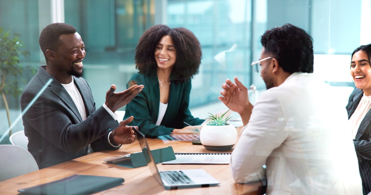 Business professionals in a supportive workplace meeting focused on wellbeing, discussion and collaboration